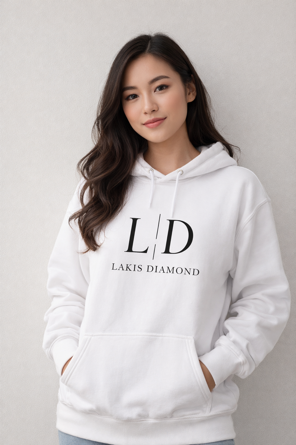 Woman wearing a white hoodie with 'Lakis Diamond' logo on a plain background